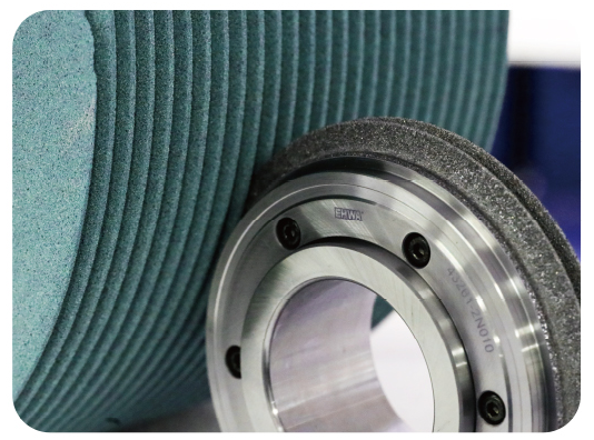 Application image of a dresser at a profiled grinding wheel.