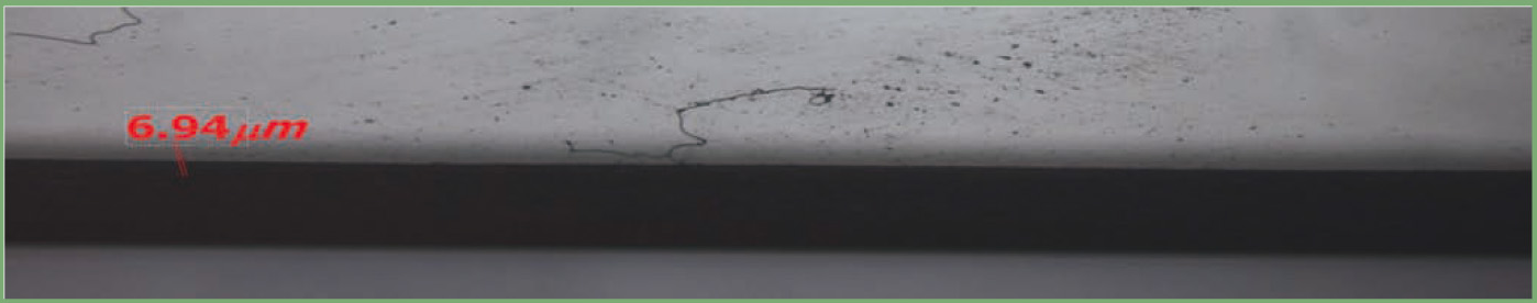 Glass edge after polyurethane polishing: local measurement marks are retained.