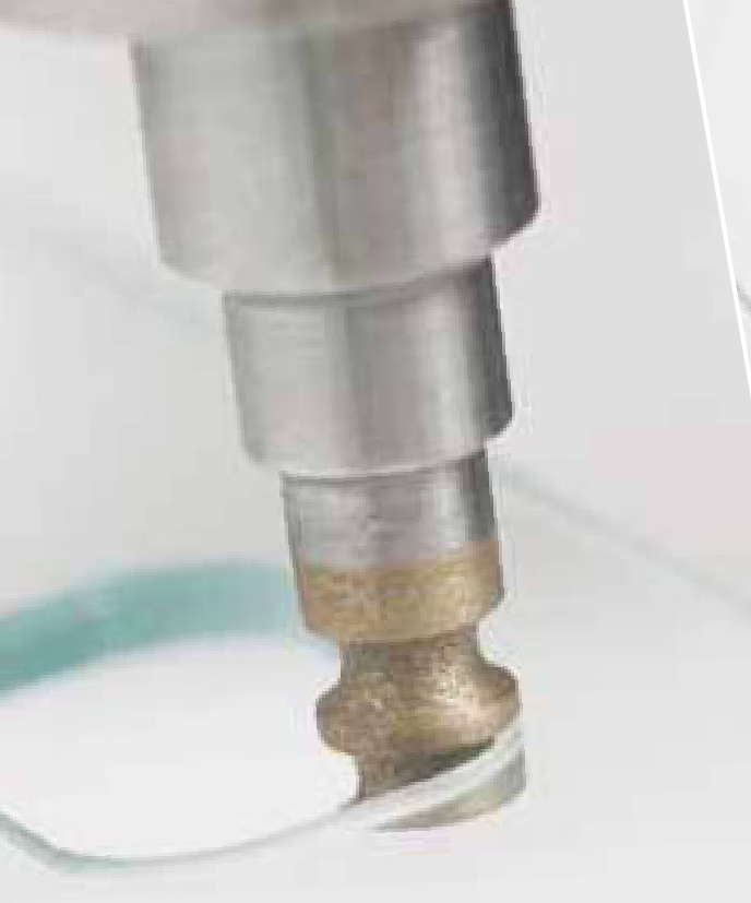 Metal-bond tool during glass-hole grinding.