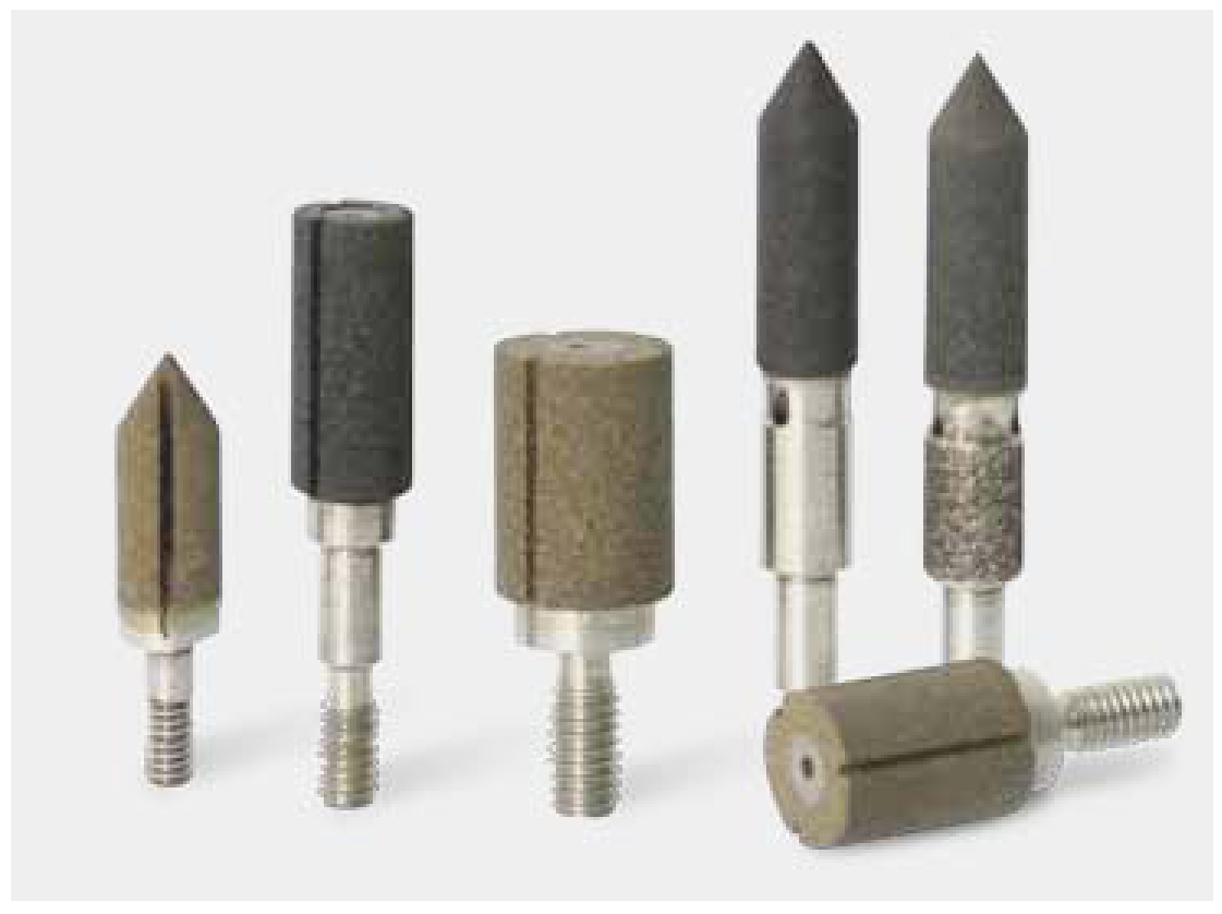 Grinding tools with different bore and seat contours.