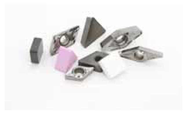 Cutting inserts in different tool materials