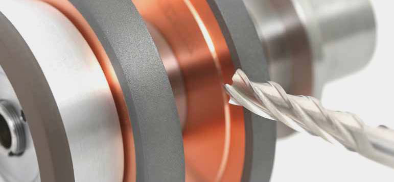 Grinding a rotary tool with a wheel pack.