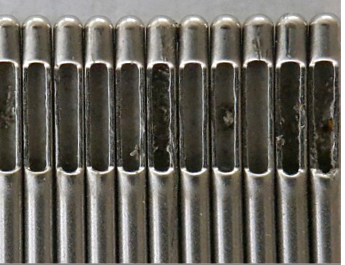 Conventionally ground needle tips with burrs.