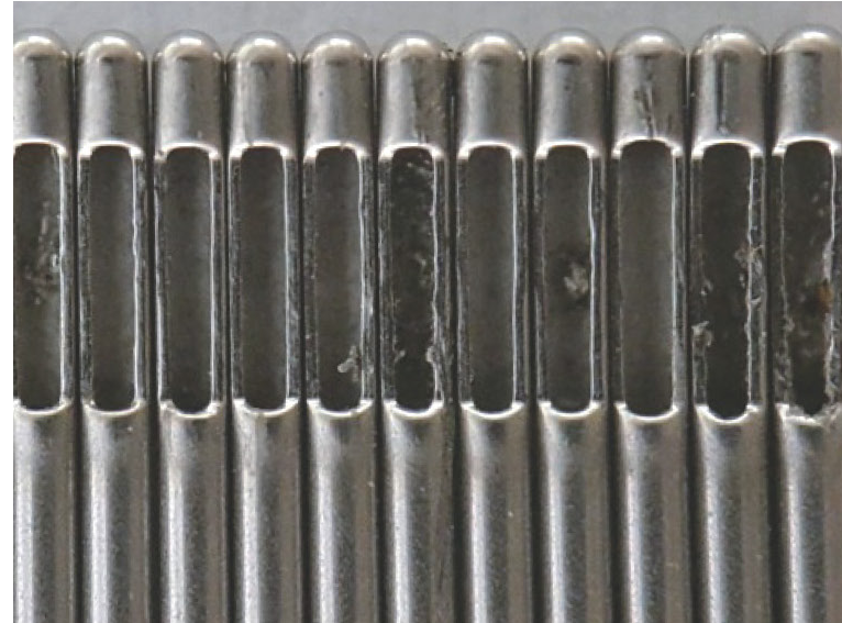 Conventionally ground needle tips with burrs.