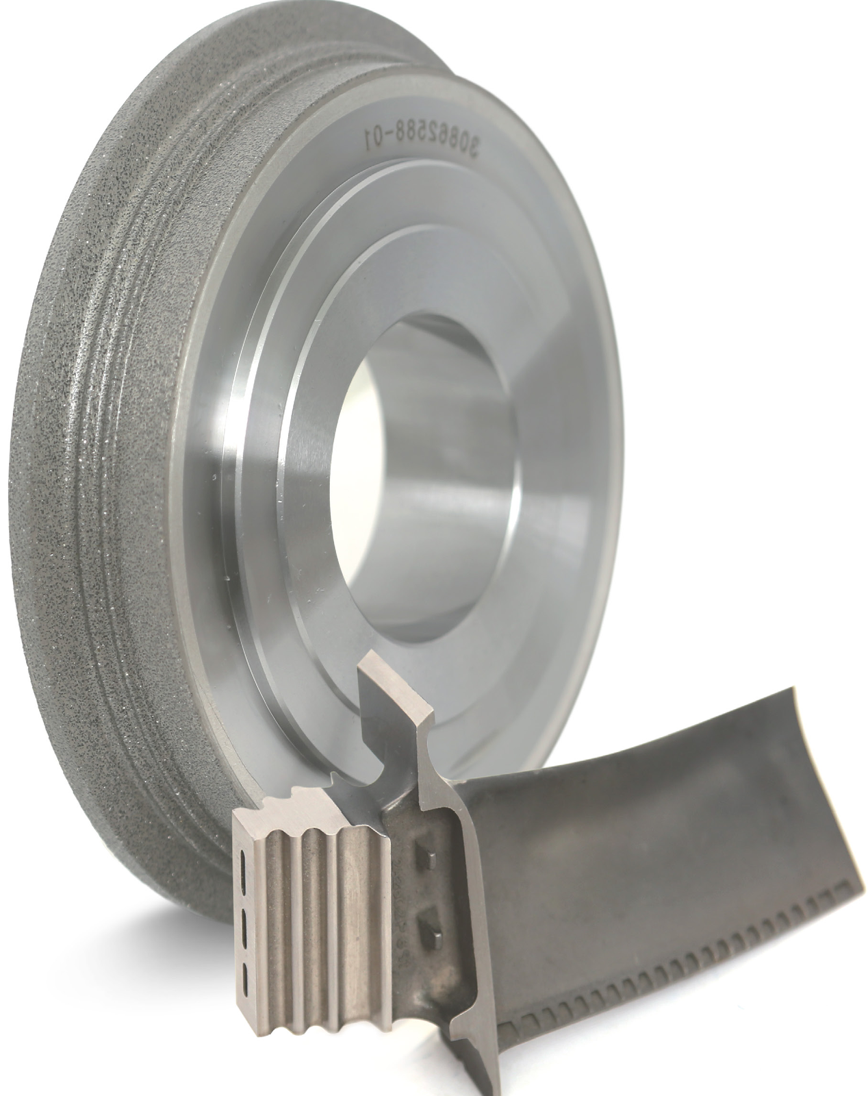 Dressing tool with a profiled turbine-blade component.